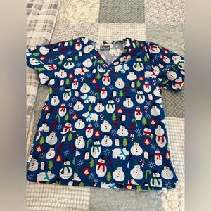 Butter-soft scrub top with snow men, polar bears and penguins. Women’s size med.
